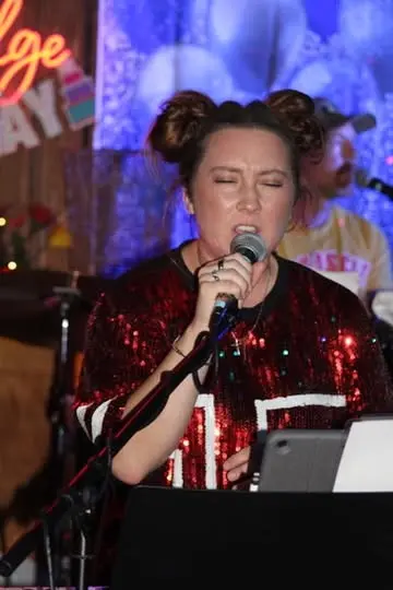 Andrea singing on stage